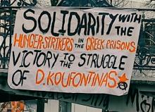 Banner mit einem Solidaritätsaufruf für Dimitris Koufodinas und griechische Gefangene
