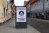 Ein Poster mit einem Portrait von Lorenz A. mit dem Text: "Sein Freund und Helfer? Sein Feind und Henker! Lorenz, ermordet von einem deutschen Polizisten."